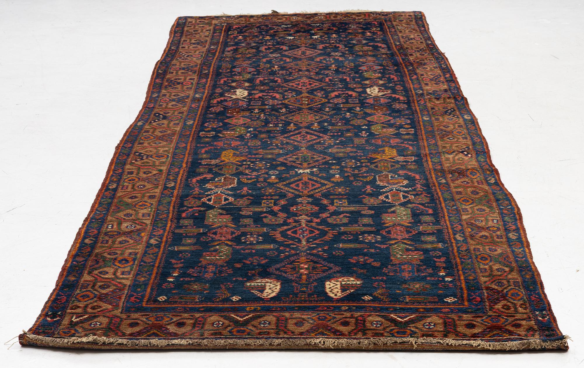 A semi-antique Northwest Persian runner, c. 388 x 94 cm.