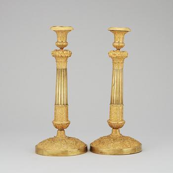 A pair of French Empire early 19th Century candlesticks.