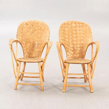 A pair of Pascal Raffier "Le Corbusier" chestnut chairs France late 20th century.