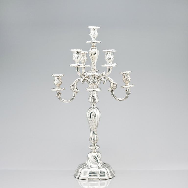 A pair of eight-light Louis XV-style silver candelabra, mark of Hermann Julius Wilm, Berlin, circa 1900.