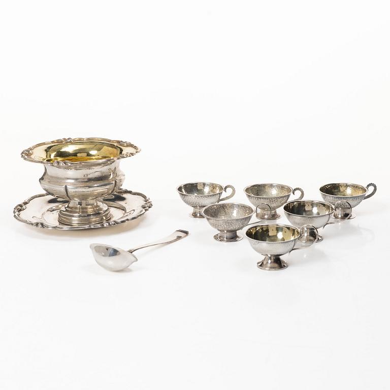 Gustaf Möllenborg, a silver bowl, Stockholm 1851, six silver punch cups, including CG Hallberg, and a silver spoon.