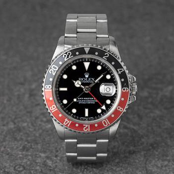 1002. Rolex, GMT-Master II, "Coke", ca 1997.