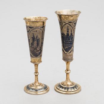 Two gilt silver and niello champagne flutes, Moscow 1842 and 1844. Unidentified maker's mark AK.