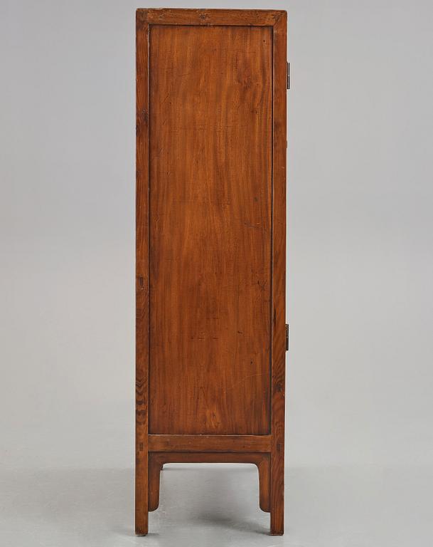 A huanghuali veneered, huamu and mixed wood cabinet, 19th century, Qing dynasty, 19th Century.