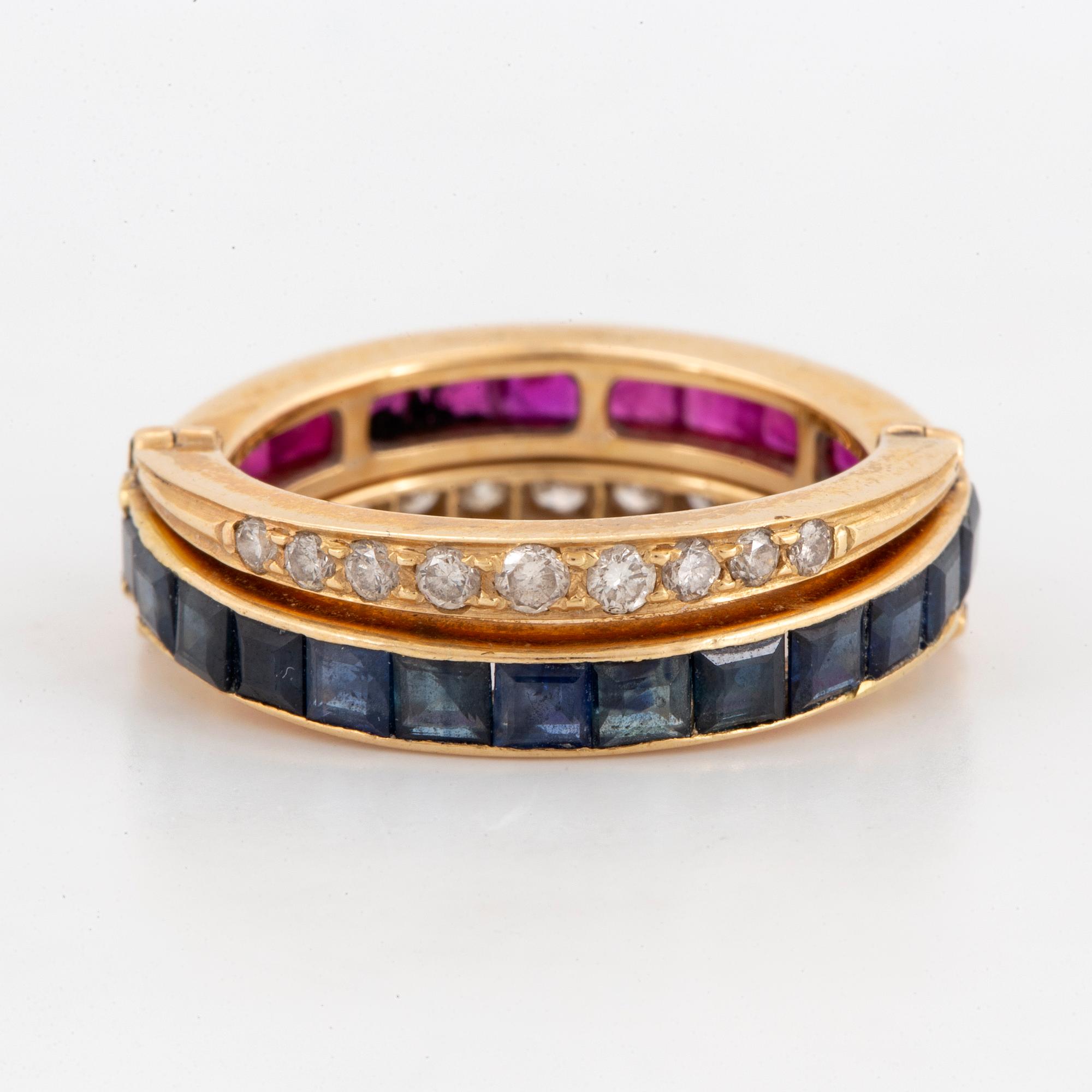 Calibre-cut ruby and sapphire and brillint-cut diamond ring.