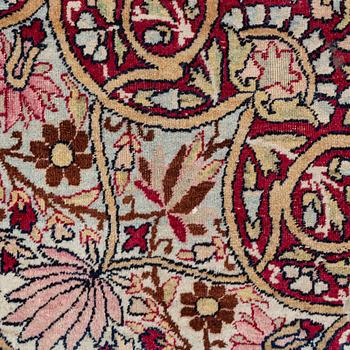 An antique Kerman Laver carpet, south east persia, ca 501 x 359 cm.