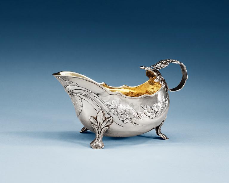 A Swedich parcel-gilt cream jug, makers mark of  Jacob Lampa, Stockholm 1759.