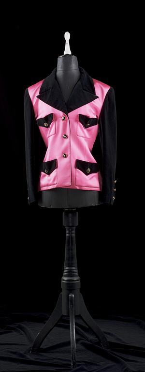 A 21th cent black velvet and cerise silk jacket by Chanel.