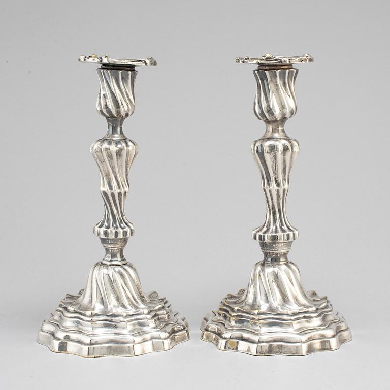 A pair of Louis XV mid 18th century candlesticks.