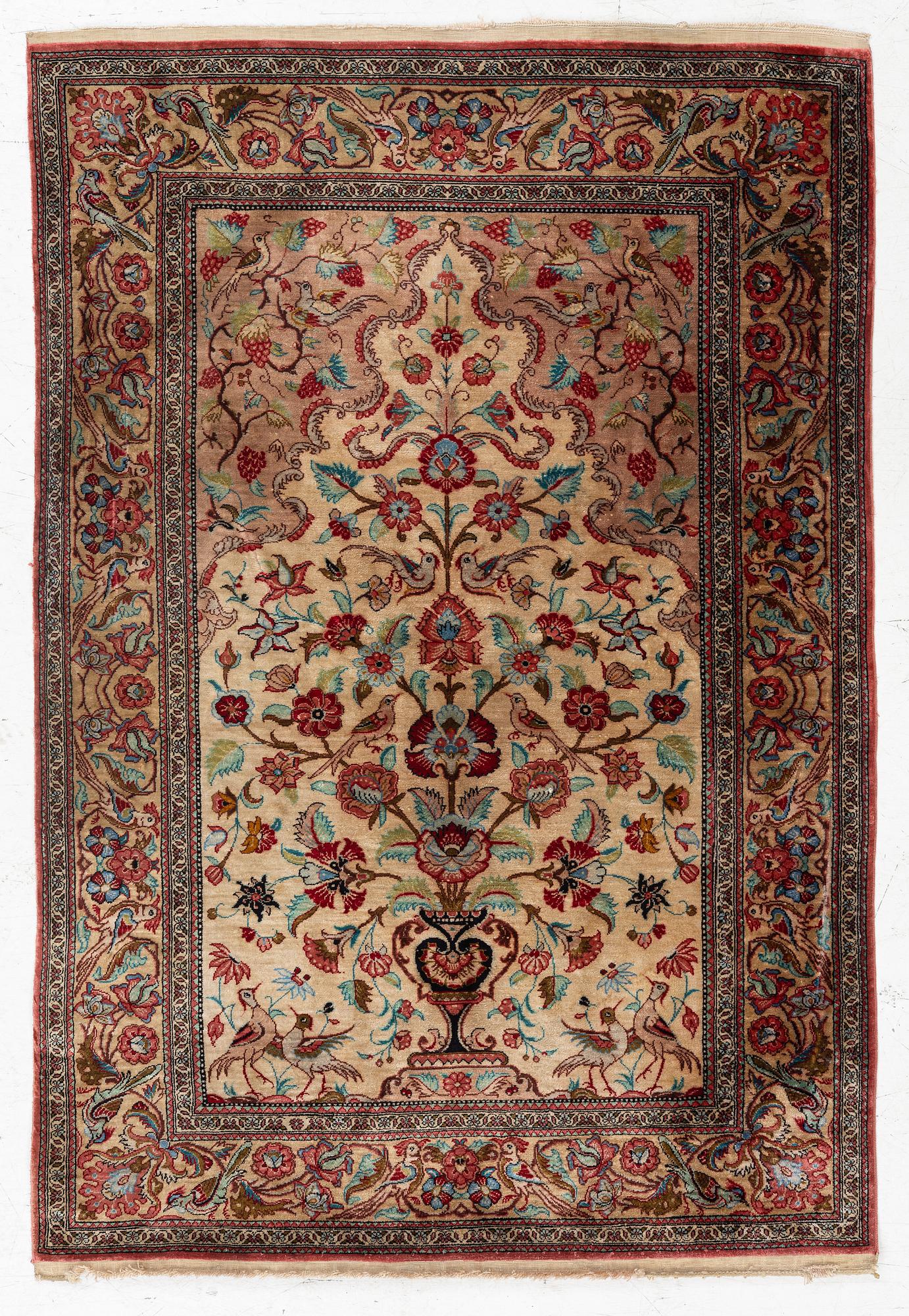 A Qum silk rug, c. 110 x 76 cm.