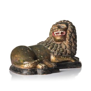 215. A carved sculpture of a lion attributed to Johan August Gustafsson (1852-1932).