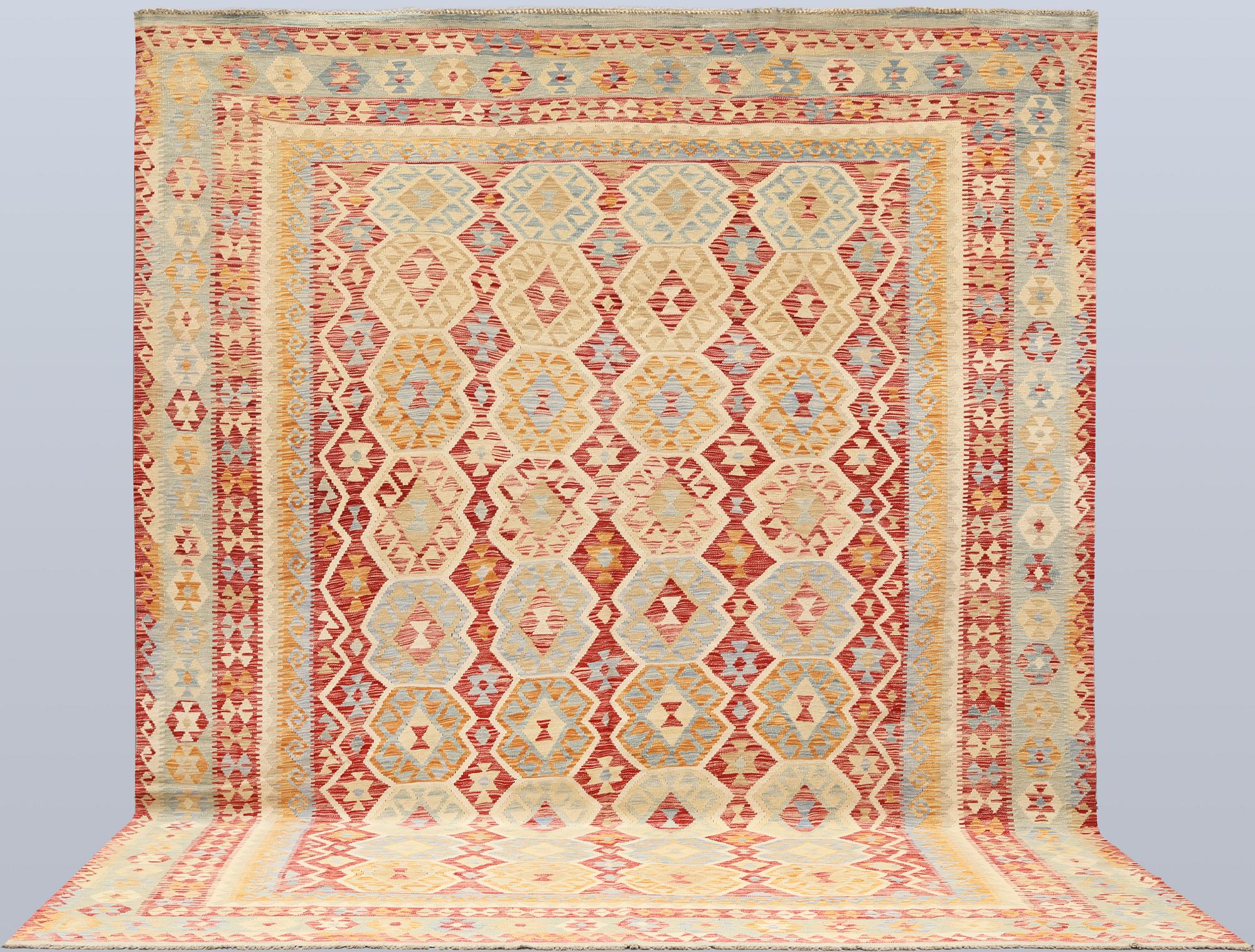 A Kilim carpet, approx. 392 x 309 cm.