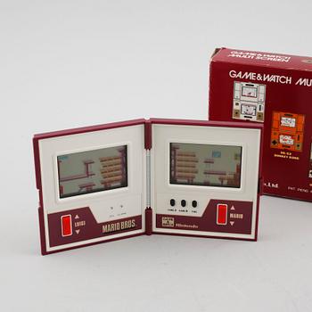 A Nintendo game & Watch, model "MW-56", multi screen, Mario Bors, 1983.