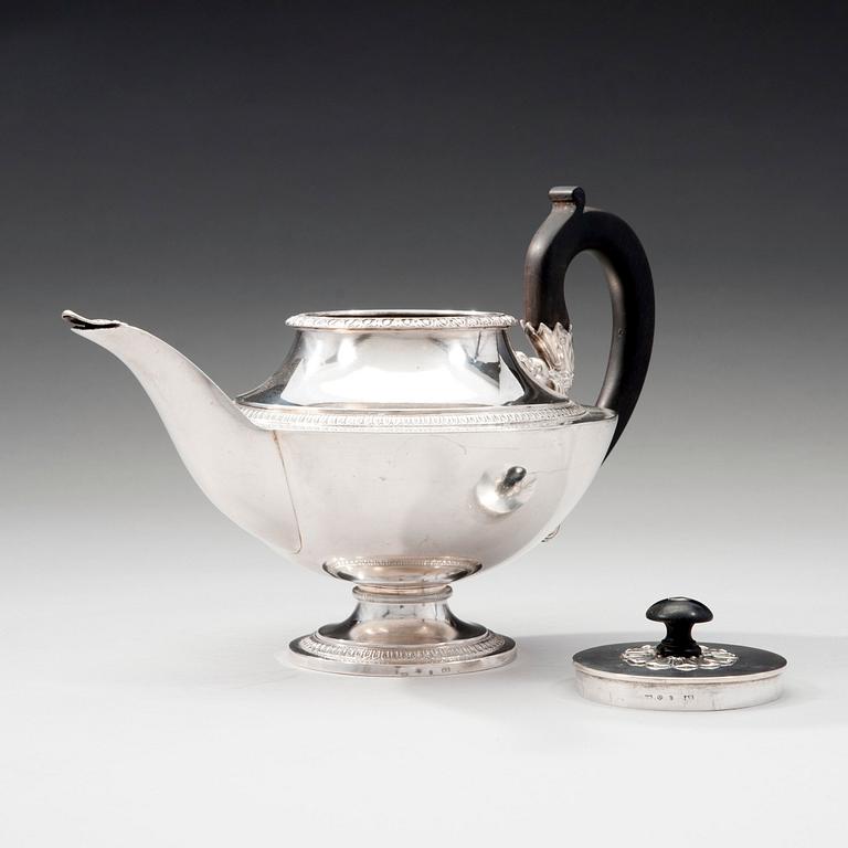 A TEA POT.