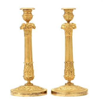 A pair of French mid 19th century candlesticks.