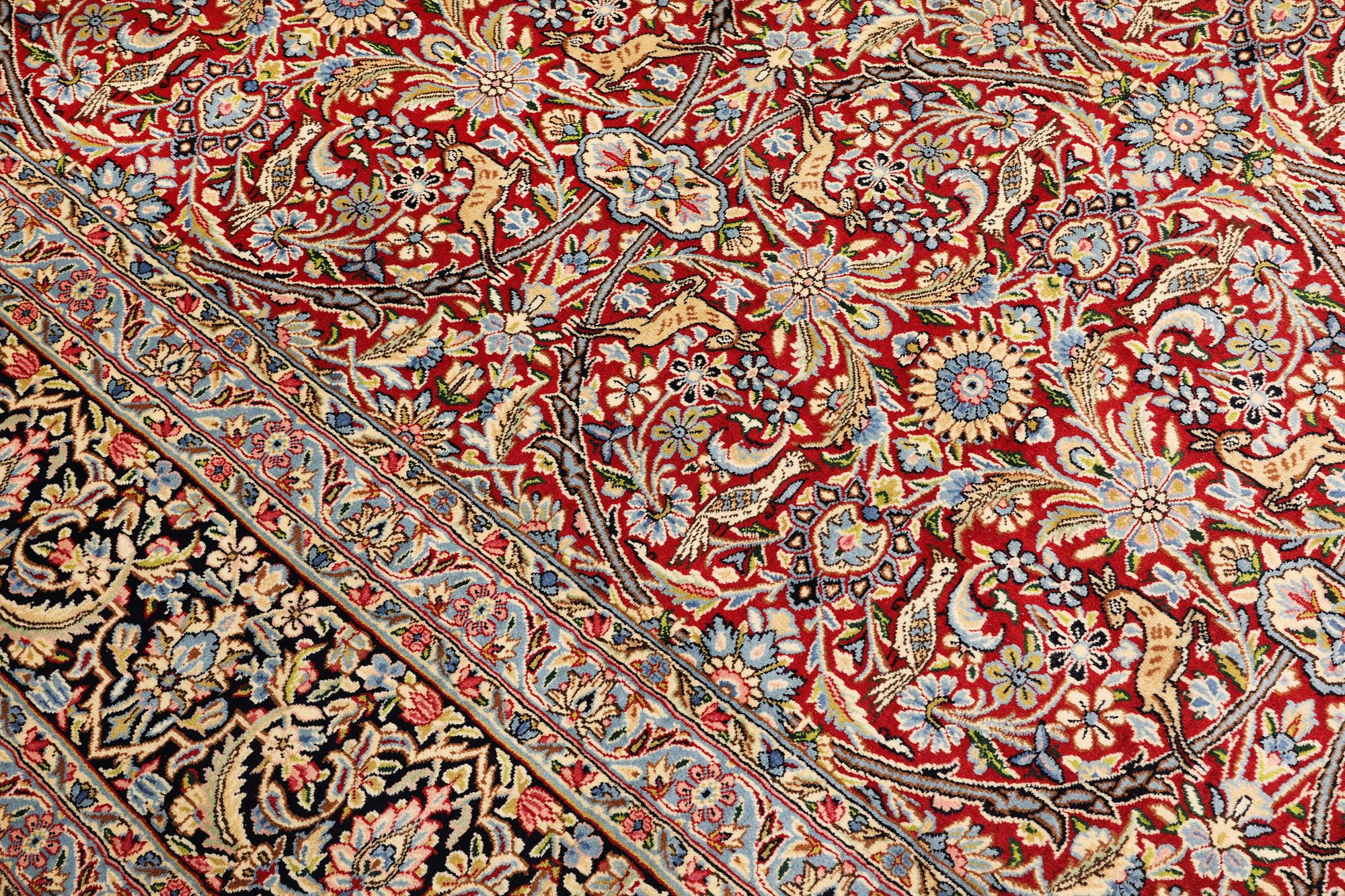 A Kirman lavar carpet, 403 x 304 cm.