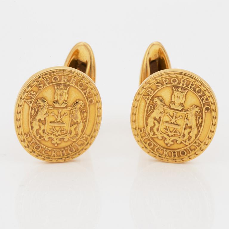 MANSCHETTKNAPPAR, Sporrong, 18K guld.