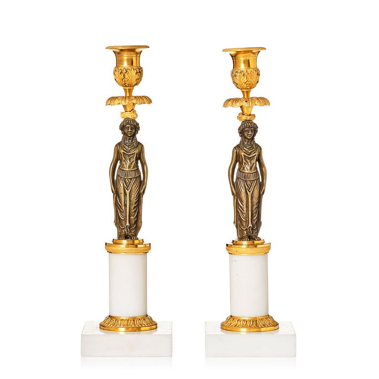 A pair of late Gustavian ormolu, patinated bronze, and marble candlessticks attributed to F. L. Rung (1758-1837).