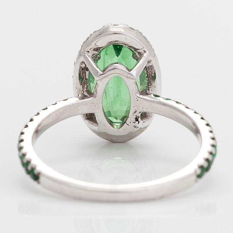 A 14K white gold ring, with tsavorite garnets and diamonds.