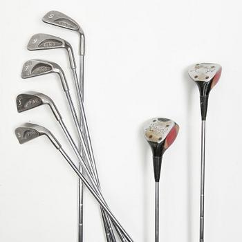 MULBERRY, a green leather golf bag with golf clubs.