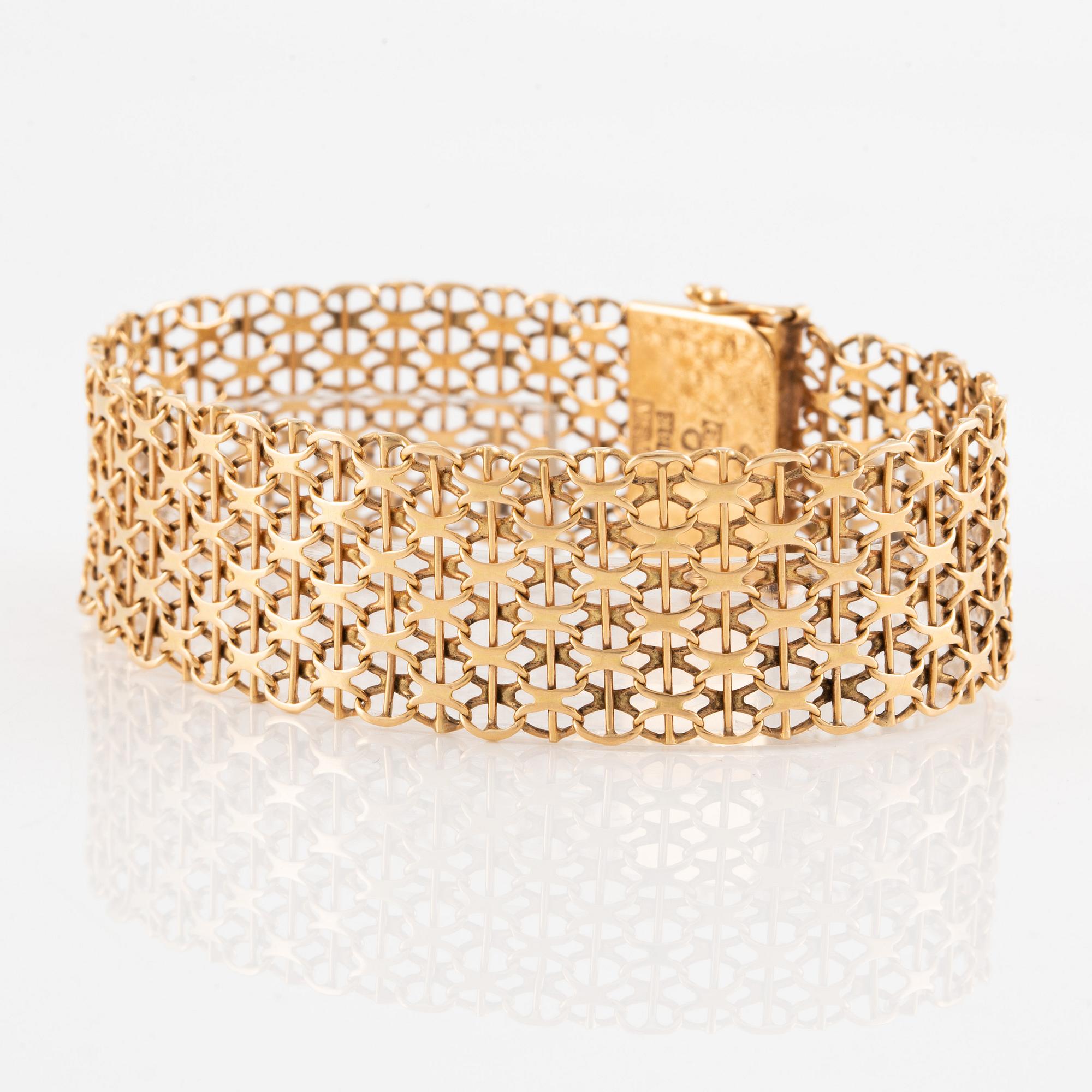 Armlänk, 18K guld, x-länk,  Ädelsmycken  AB, Stockholm 1969.