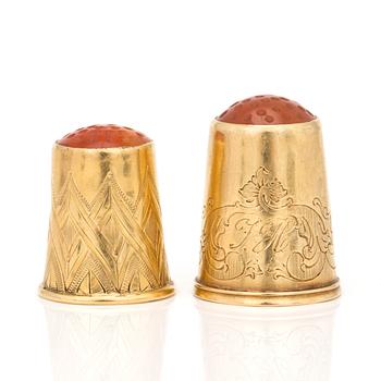 Two18K gold thimbles with carnelian.