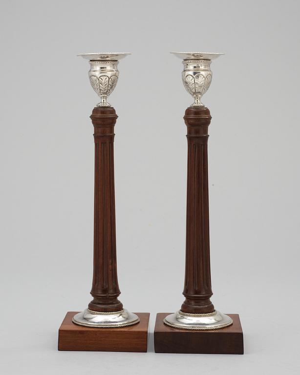 A pair of Swedish silver and mahogany candlesticks by Peter Ohlijn, Karlskrona 1800.