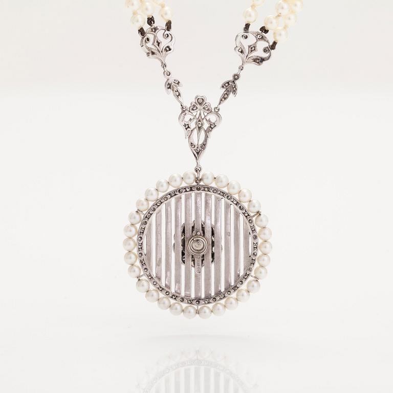 An 18K white gold necklace with cultured pearls, enamel and brilliant-cut diamonds. England.