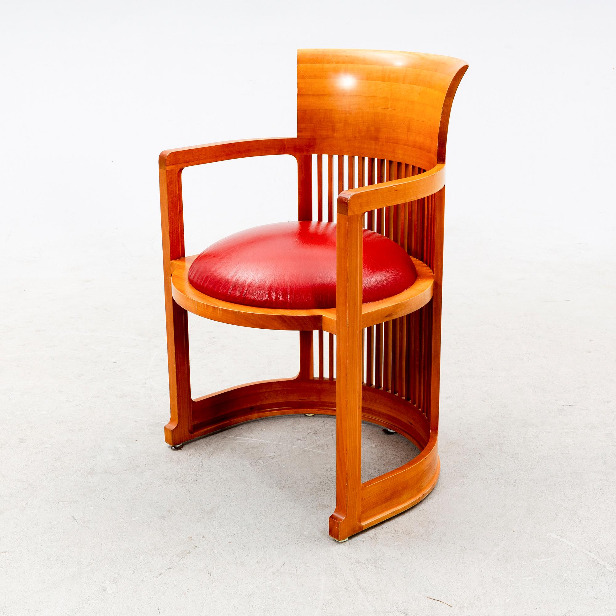 A cherry wood model 606 'Barrel' chair by Frank Lloyd Wright from Cassina.