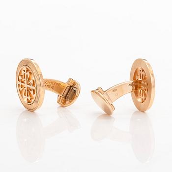 Patek Philippe, a pair of 18K gold "Calatrava" cufflinks.