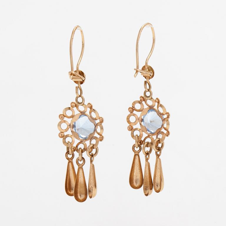 A pair of 14K gold earrings with synthetic spinels.