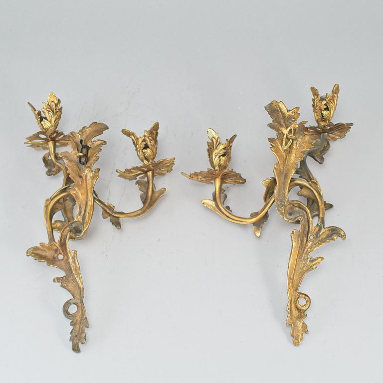 A pair of brass sconces, circa 1900.