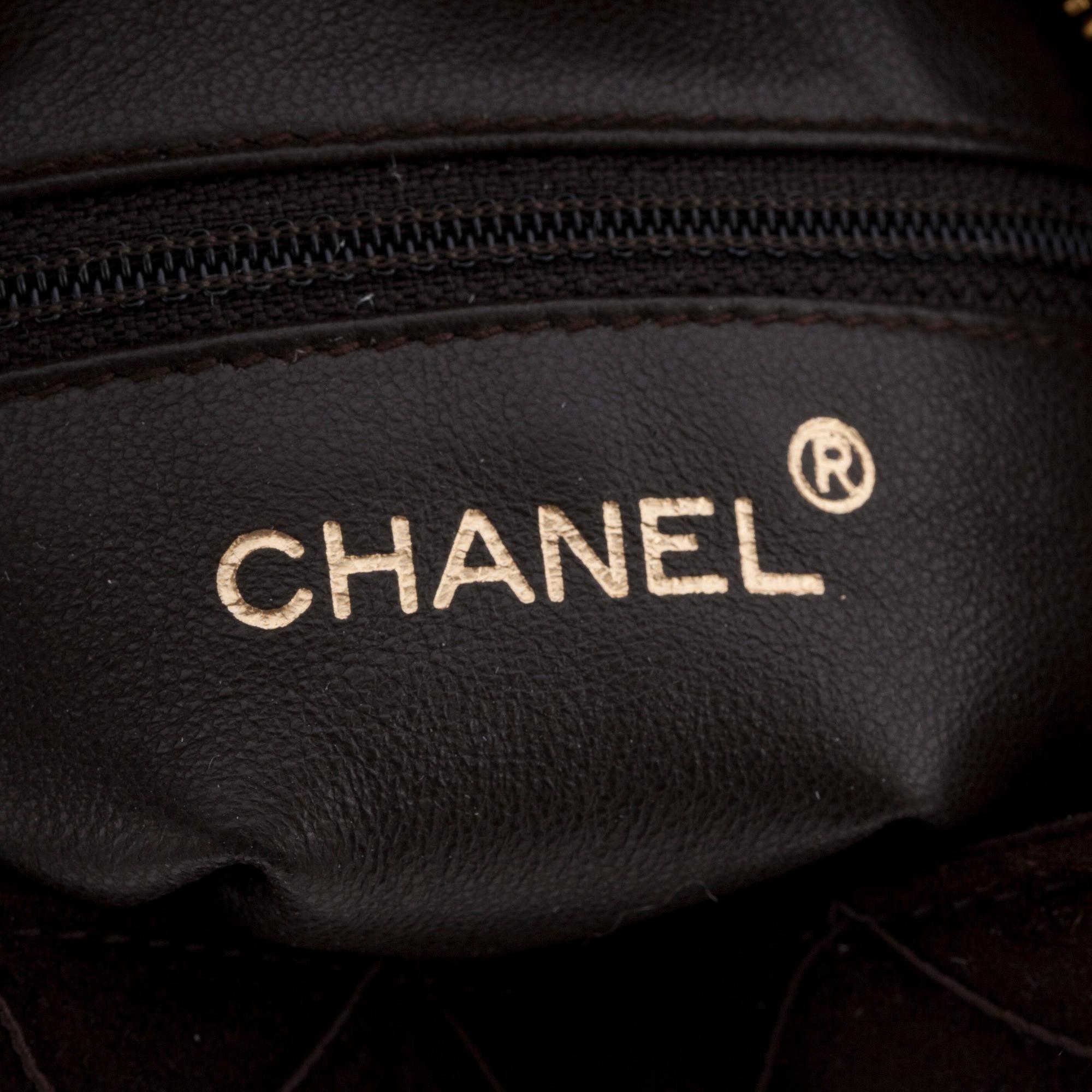 CHANEL, a brown suede cross body bag.