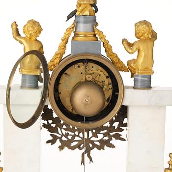 A French Louis XVI ormolu and marble portico mantel clock, late 18th century.