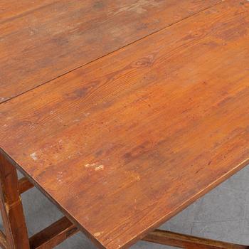 A pine gate leg table, 19th Century.