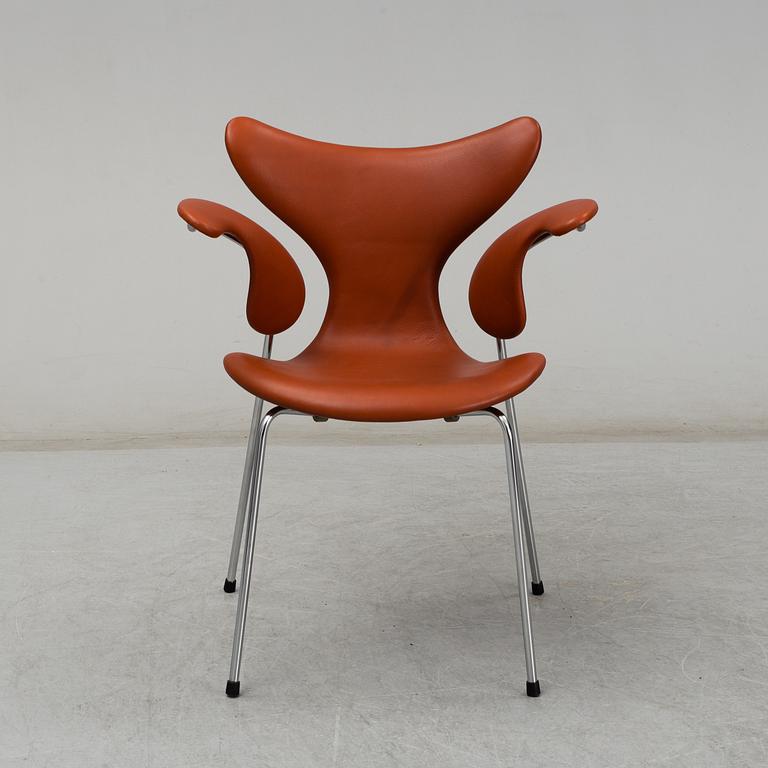 ARNE JACOBSEN, a 'Lily' leather covered armchair from Fritz Hansen, Denmark.