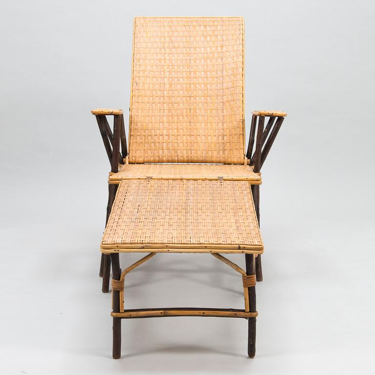 An early 20th century rattan lounge chair/sun chair.