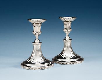 828. A PAIR OF SWEDISH SILVER CANDLESTICKS, Makers mark of Simson Ryberg Stockholm 1780.