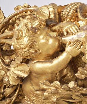 A presumably Dutch Louis XIV carved giltwood frame with mirror glass, in the style of Jean Le Pautre, late 17th century.