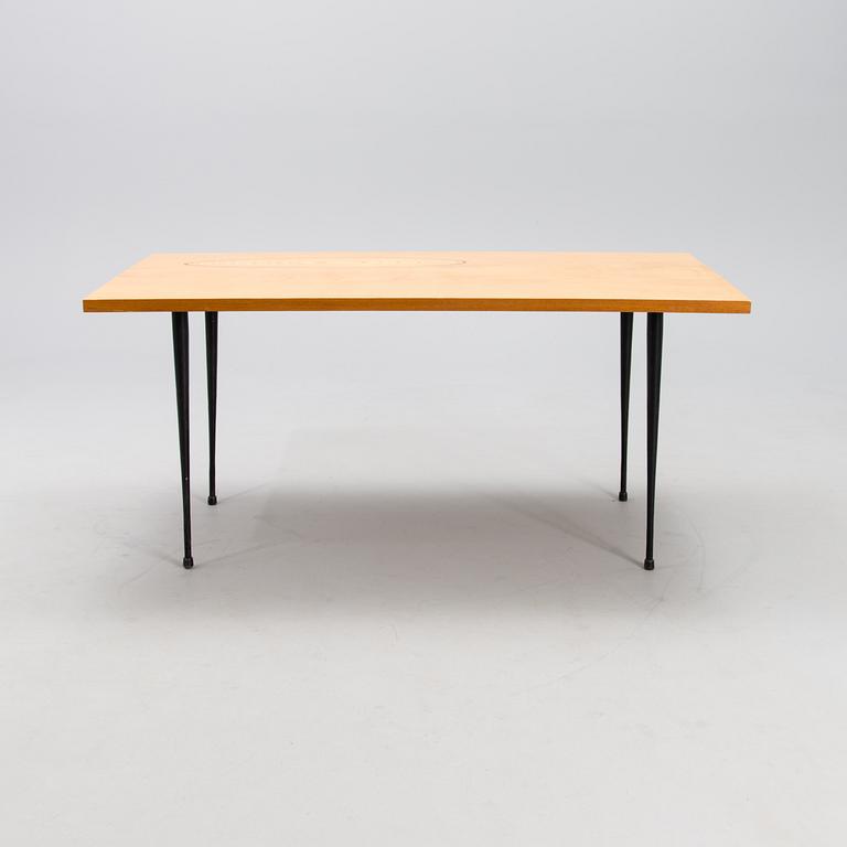 A coffee table marked Tapio Wirkkala, Asko, Made in Finland.