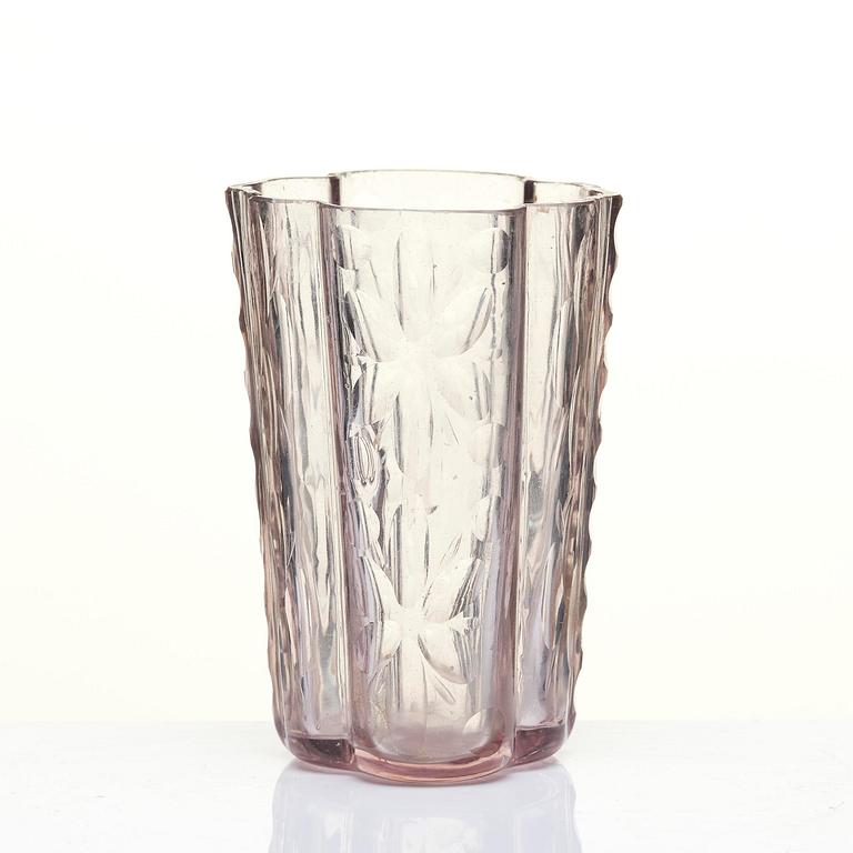 An amethyst coloured suger shaker and a cut glass goblet, 18th century.