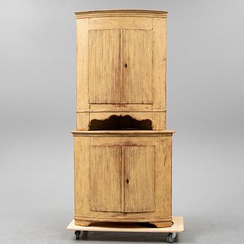 A Swedish late Gustavian corner cabinet in two parts.