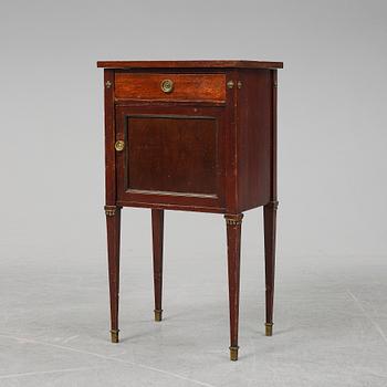 A first half of the 20th century mahogany veneered bedside table.