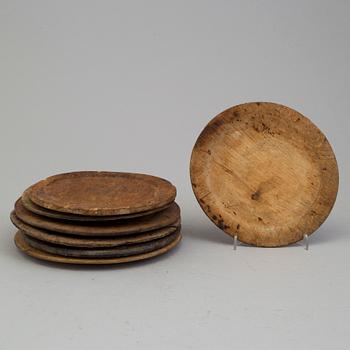 SEVEN WOODEN PLATES, 18th/19th century.