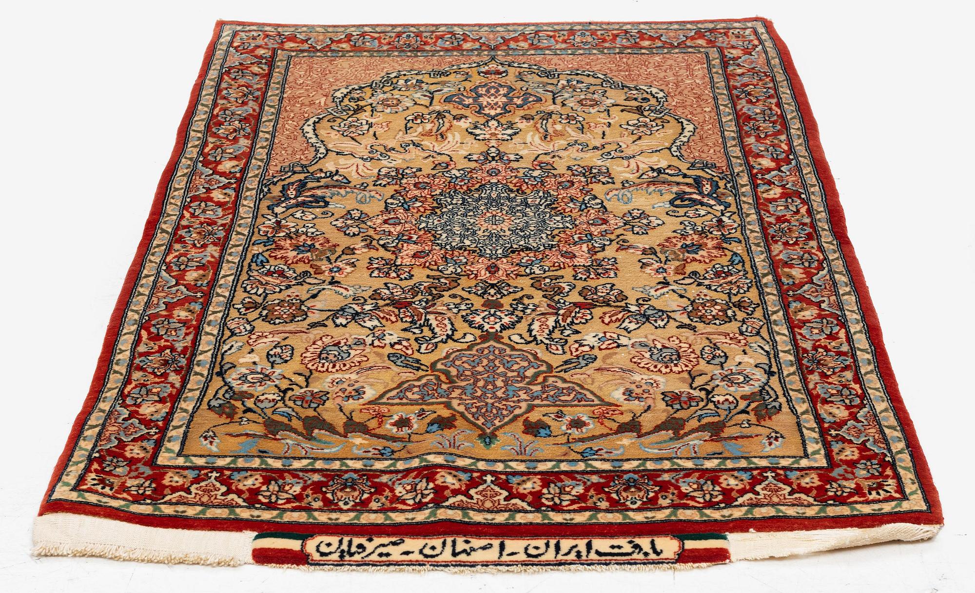A semi-antique Isfahan rug, central Iran, part silk, signed (Mohammed) Seirafian, c. 120 x 70 cm.