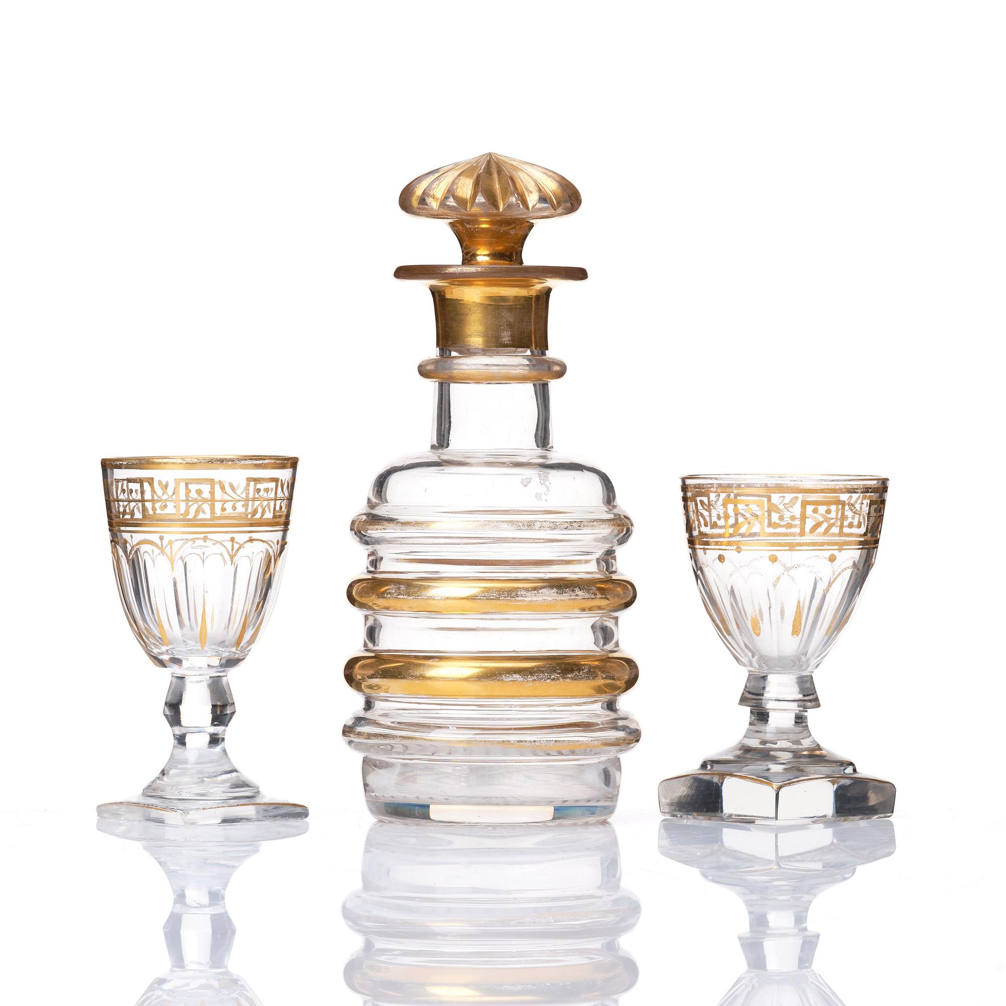 A set of Russian glasses (13 pcs.) and a bottle with stopper, 19th Century.