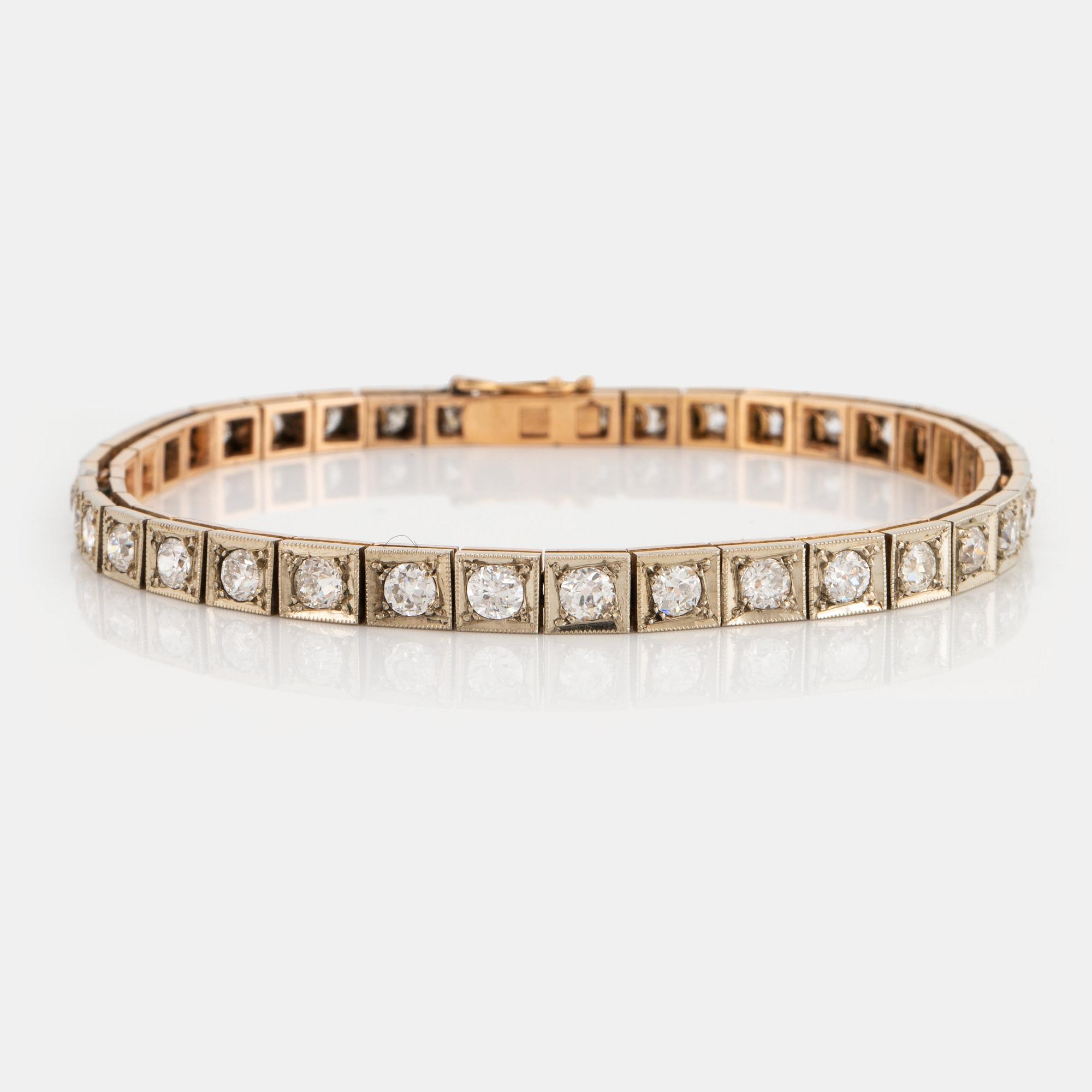 A 14K gold bracelet set with old-cut diamonds.