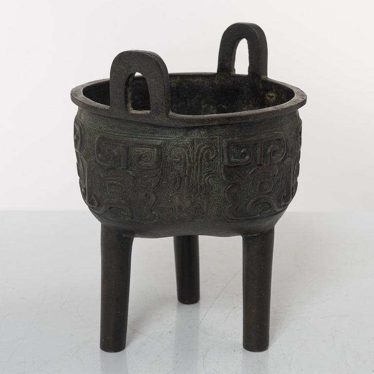 A Chinese tripod bronze censer, Ming style, Qing dynasty (1644-1912).