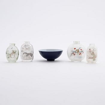 Four Chinese glass snuff bottles and one blue monochrome porcelain bowl, 20th century and modern manufacturing.