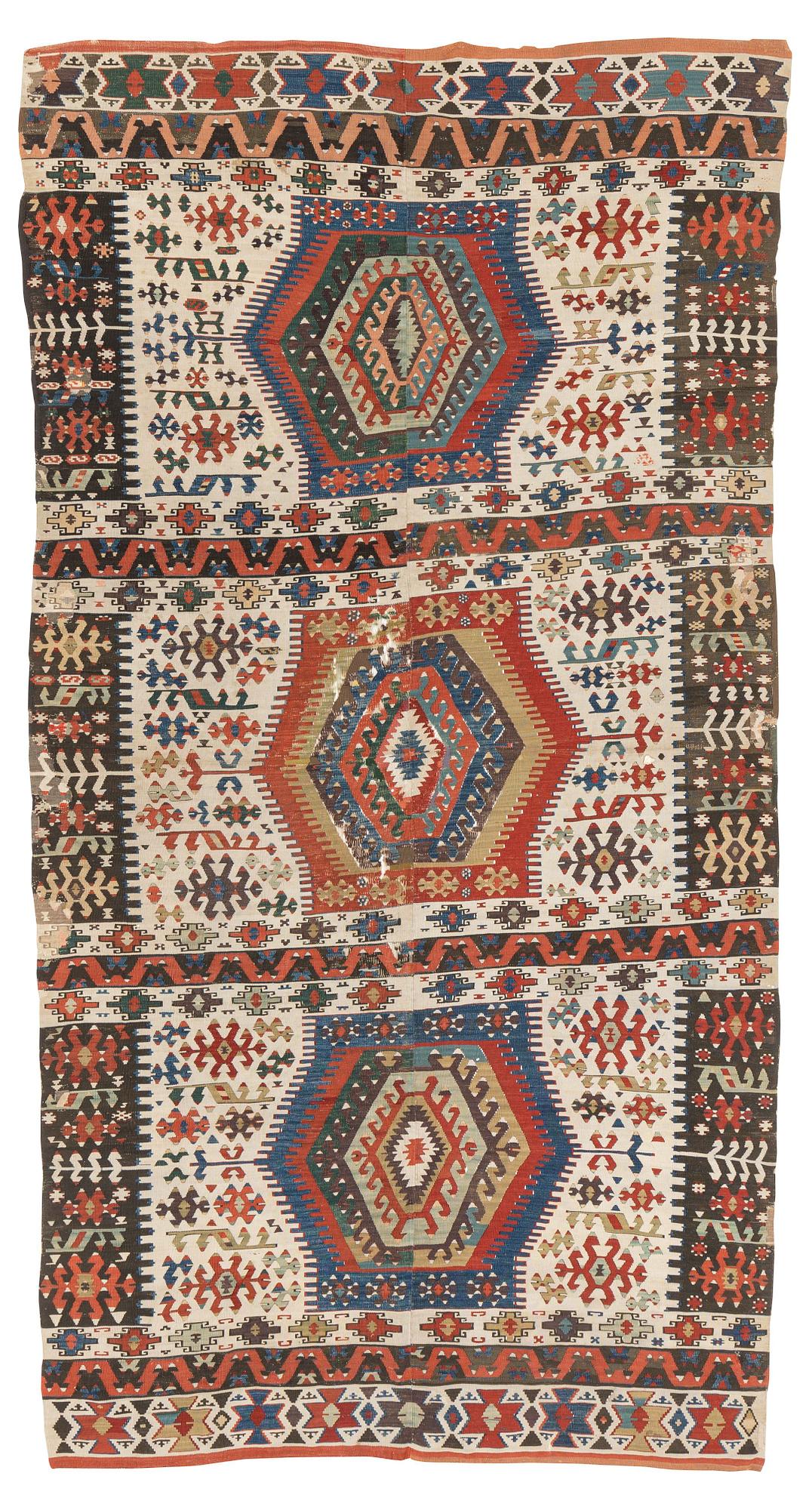 An antique Anatolian kilim, ca 324 x 169 cm.